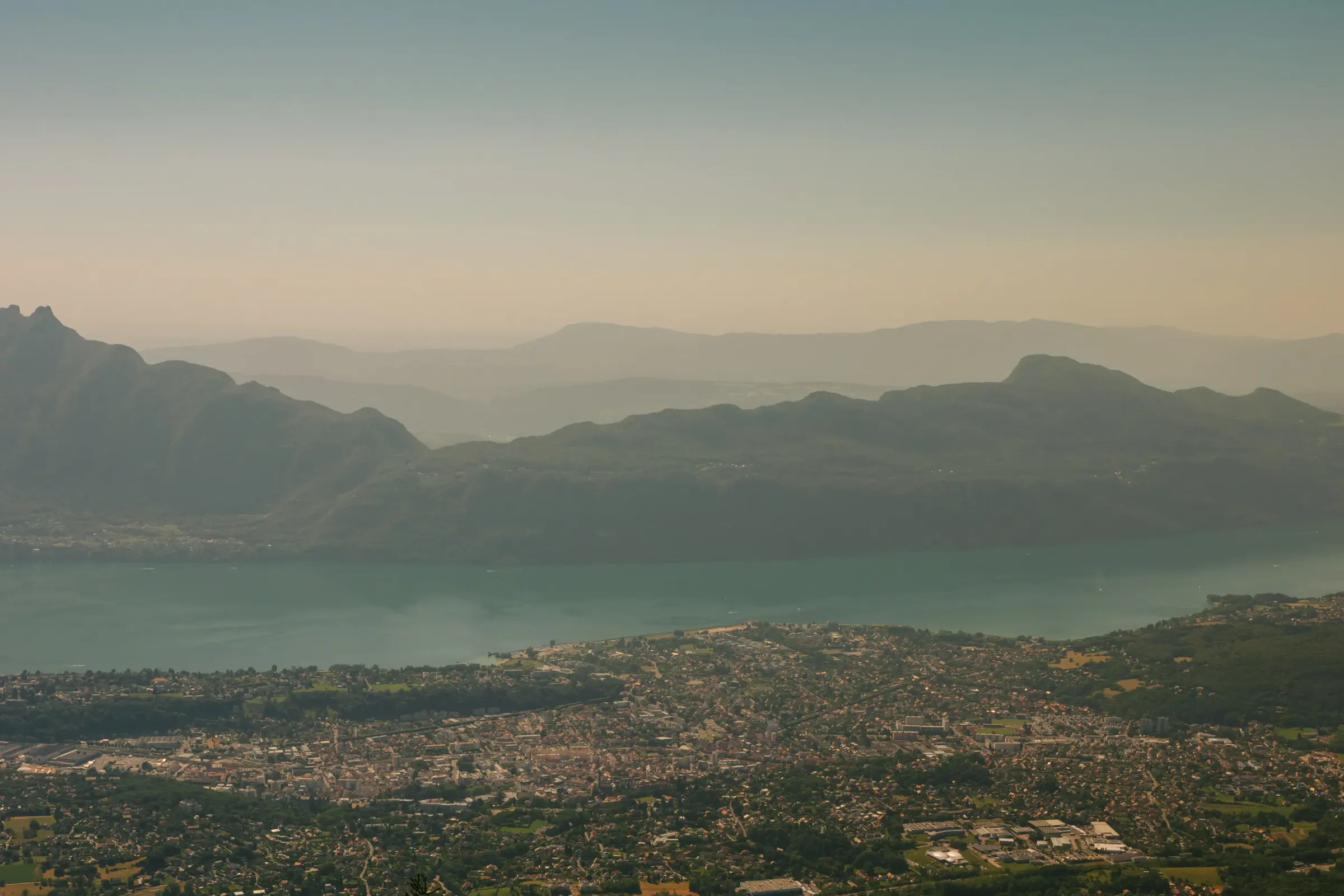 Coastal city bordered by a lake and surrounded by mountains
